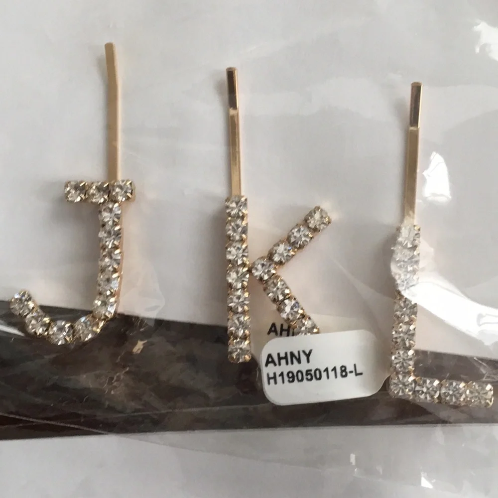 Anthropologie rhinestone initial barrettes.‎ Great!